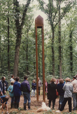Photograph of visitors gathered around sculpture House