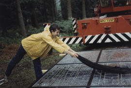 Photograph of Rupert Martin drying the glass of Cathedral before installation