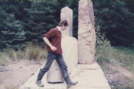 Photograph of Tim Lees walking past Heart of the Stone