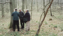 Photograph of Ingemar Thalin and others next to sculpture Life Cycle